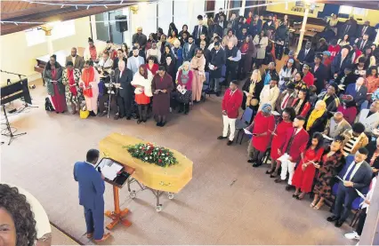  ?? Dan Regan ?? Mourners at Cornerston­e Church wore colourful outfits at the funeral of Reverend Dr Marcelline Beatrice Mudisi-Robinson, left, who died in a car crash on the M4 in December