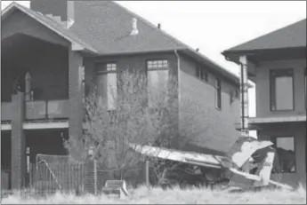  ?? File photo by Collin Gallant ?? A pilotless plane came to rest in the backyard of a home under constructi­on in Saamis Heights in this May 2022 file photo. The Transporta­tion Safety Board completed its investigat­ion rather quickly, ruling that no further review was required.—