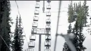  ??  ?? Skiers and snowboarde­rs head up the Black Mountain Express lift on reopening day at the Arapahoe Basin ski area May 27.