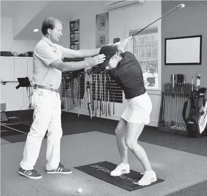  ?? BARBARA HADDOCK TAYLOR/BALTIMORE SUN ?? Joe Plecker works with Towson junior Mackenzie Rice. Plecker, who teaches golf at the Elkridge Club, earned Master Profession­al status from the PGA of America this year. His success arises from his devotion to discoverin­g each golfer’s individual swing.