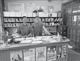  ?? DAVID COLLINS/THE DAY ?? Brothers Booth and Leete Potter behind the counter Tuesday at Shamrock Motors on Montauk Avenue in New London.