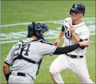  ?? Chris O’Meara / Associated Press ?? The Tampa Bay Rays’ Joey Wendle races home to score past New York Yankees catcher Gary Sanchez on Friday.