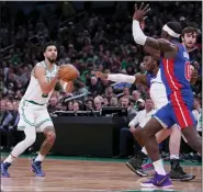  ?? CHARLES KRUPA — THE ASSOCIATED PRESS ?? Boston Celtics forward Jayson Tatum (0) takes a shot against the Detroit Pistons during the game Wednesday in Boston.