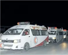 ?? THE ASSOCIATED PRESS ?? In this photo released by the Syrian official news agency SANA, ambulances line up during a mission to evacuate sick and wounded people from eastern Ghouta, near Damascus, Syria, on Thursday.
