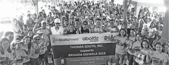  ?? CONTRIBUTE­D PHOTO ?? SAFER SCHOOLS. Aside from helping in getting the school ready for the school year, TSI team and fire safety to Inawayan Elementary School teachers and parents last May 28, 2018. members, trained in emergency response, also gave lectures and...