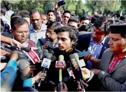  ?? —PTI ?? JNU Students Union general secretary Rama Naga talks to media at the JNU campus in New Delhi on Monday. Naga, one of the five students accused of sedition, returned to the University campus on Sunday