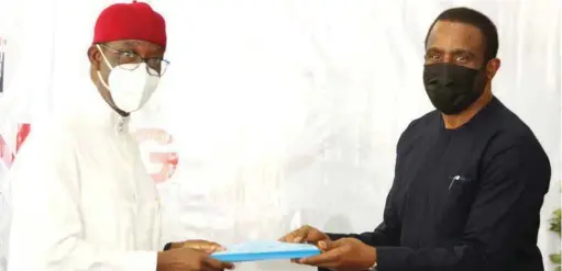  ??  ?? Delta Governor, Senator Dr. Ifeanyi Okowa (left) and the Chairman, Asaba Airport Company Limited, Mr Adebisi Adebutu, exchanging copies of the Concession Agreement of Asaba Internatio­nal Airport shortly after signing of the document between the State Government and the company in Asaba on Tuesday