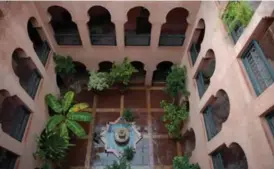  ??  ?? Above: Stay at Kasbah Omar and you can sign up for lessons in traditiona­l cooking in its open-air kitchen. Left: No television­s here — just a sense of peace and quiet. The hotel is built in the road-style, which always includes a central courtyard with...