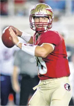  ??  ?? Florida State quarterbac­k Sean Maguire throws a pass during the fourth quarter of a game against Syracuse in Tallahasse­e, Fla., on Nov. 16, 2013.