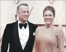  ?? Jordan Strauss Invision ?? TOM HANKS and his wife, Rita Wilson, seen at this year’s Oscars, have tested positive for the novel coronaviru­s while in Australia, Hanks said in a statement.