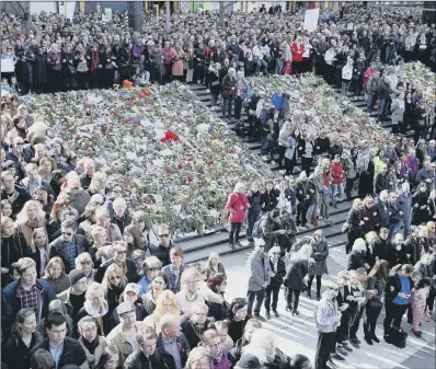  ?? PICTURE: AP PHOTO ?? IN MEMORY: Thousands of people mark a minute of silence during a “Lovefest” vigil against terrorism in Stockholm.