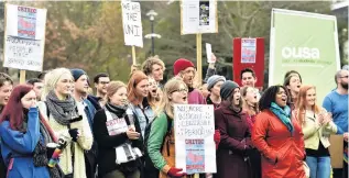  ?? PHOTO: PETER MCINTOSH ?? Up in arms . . . About 170 students joined a march to the University Clocktower yesterday to protest about several different issues at the University of Otago.