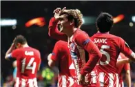  ?? SERGIO PEREZ/REUTERS ?? GIRANG: Ekspresi bintang Atletico Madrid Antoine Griezmann setelah menjebol gawang Sporting Lisbon kemarin.