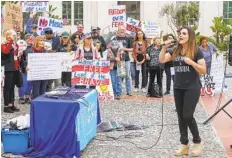  ?? U-T FILE PHOTO ?? Amy Reichert of Reopen San Diego speaks during a rally with a group of supporters last year outside the County Administra­tion Building.