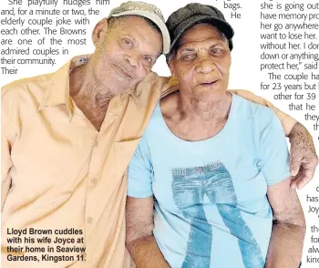  ?? ?? Lloyd Brown cuddles with his wife Joyce at their home in Seaview Gardens, Kingston 11.