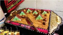 ??  ?? Cakes designed to look like the pyramids of Egypt.