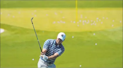  ?? David J. Phillip The Associated Press ?? Jordan Spieth, who won the Valero Texas Open, works on the range Monday afternoon during a practice day for the Masters.