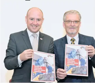  ??  ?? Review published
Councillor­s Frank McNally and Bob Burrows with the report