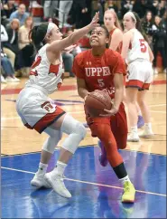  ?? GENE WALSH/FOR MEDIANEWS GROUP ?? Upper Dublin’s Anajae Smith drives the lane near Plymouth Whitemarsh’s Anna McTamney on Saturday.