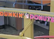  ?? AP FILE PHOTO/ GENE J. PUSKAR ?? A Dunkin’ Donuts is pictured at the Greater Pittsburgh Internatio­nal Airport in Moon, Pa.