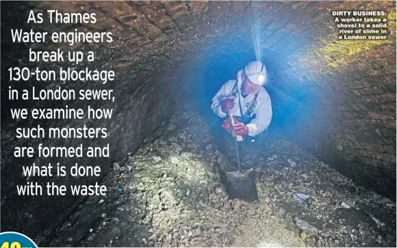  ??  ?? DIRTY BUSINESS: A worker takes a shovel to a solid river of slime in a London sewer