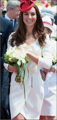  ??  ?? Royal following: The Duchess of Cambridge in the same Reiss dress she wore for her official engagement photograph