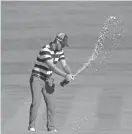  ?? KYLE TERADA/USA TODAY SPORTS ?? Kevin Chappell sprays champagne on the 17th hole after the Americans clinched their seventh consecutiv­e win in the Presidents Cup on Sunday.