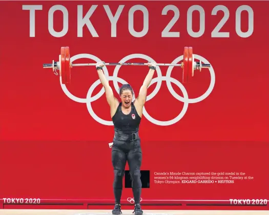  ?? EDGARD GARRIDO • REUTERS ?? Canada’s Maude Charron captured the gold medal in the women’s 64-kilogram weightlift­ing division on Tuesday at the Tokyo Olympics.