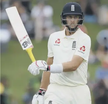  ??  ?? 0 Joe Root swishes his bat in annoyance as he leaves the field after being dismissed by Anrich Nortje