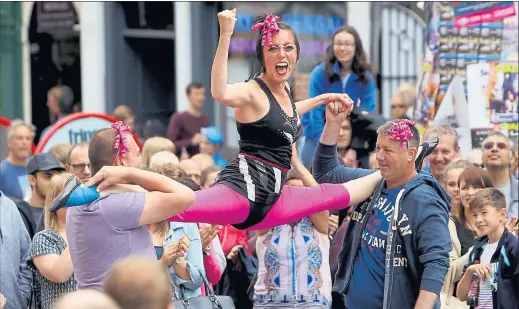  ??  ?? ON A HIGH: Edinburgh’s Royal Mile is packed with street performers and spectators yesterday as the Fringe Festival draws to a close for another year. Picture: Gordon Terris