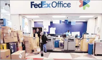 ?? Mark Lennihan/associated Press ?? Fedex has pumped $943 million in capital dollars since mid-2009 into its Fedex Services segment, an investment that is helping its Fedex Office unit win big commercial contracts such as its new deal with Boeing.