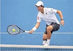  ?? AFP ?? Kei Nishikori hits a return against Jordan Thompson.