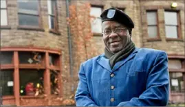  ?? Darrell Sapp/ Post- Gazette ?? Rev. Sheldon Stoudemire stands in front of the Braddock Carnegie Library in November 2018.