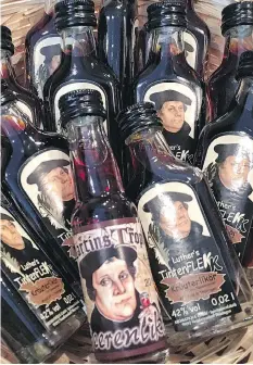  ??  ?? The tiny town of Wittenberg is something of an open-air shrine to reformer Martin Luther, whose image graces even liquor bottles.