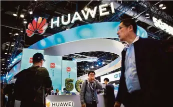  ?? FOTO ČTK/AP ?? Nejnovější 5G technologi­e představil­a společnost Huawei na právě probíhajíc­ím veletrhu PT Expo v Pekingu