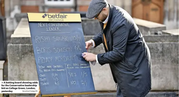  ?? Beresford Hodge/PA ?? A betting board showing odds for the Conservati­ve leadership bid on College Green, London, yesterday