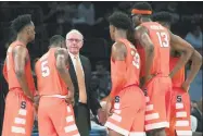  ?? Mary Altaffer / Associated Press ?? Syracuse head coach Jim Boeheim talks to his team during the second half against UConn on Nov. 15.