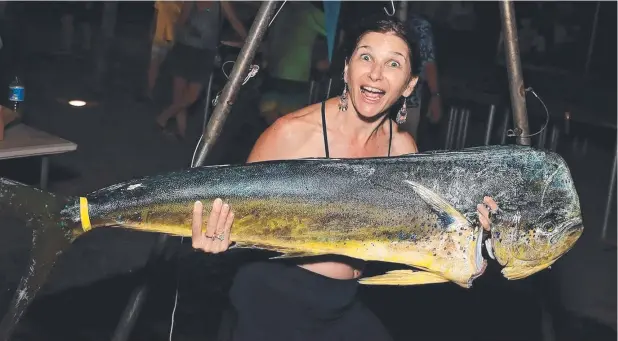  ?? Picture: SUPPLIED ?? REELIN’ IN: This big mahi mahi was caught by Tina Cross aboard On Strike during the Ribbons Ladies Game Fishing Club's annual tournament.