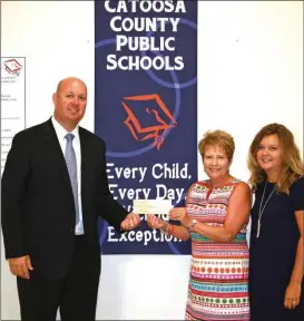  ??  ?? NHC Healthcare of Fort Oglethorpe recently donated $6,000 to Catoosa County Public Schools to assist with the medical science classes of the three high schools. From left: NHC director Craig Jones, Schools Superinten­dent Denia Reese, and Catoosa County...