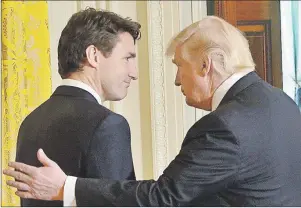  ?? CP PHOTO ?? Prime Minister Justin Trudeau and U.S. President Donald Trump depart after holding a joint news conference at the White House, in Washington, D.C., in February. The Liberal government has delayed the release of its new defence policy, setting up a...