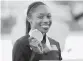 ?? DAVID J. PHILLIP AP ?? Allyson Felix States holds a bronze medal for the mixed relay at the world championsh­ips, her 19th medal at worlds and 30th overall including the Olympics.
