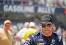  ?? AP PHOTO/DARRON CUMMINGS ?? Conor Daly walks through Gasoline Alley after practice at Indianapol­is Motor Speedway last May. The IndyCar driver said he’s open to the possbility of a last-minute ride in NASCAR’s Daytona 500 this month.