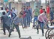  ?? (AFP) ?? Protestors clash with security forces after the funeral procession of slain militant Yawar Nissar at Shipora, in Anantnag on Friday