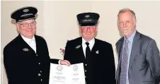  ??  ?? Pictured, from left to right, are Richard Bruce and David Smith of Quorn and Woodhouse Station on the Great Central Railway collecting their Silver Award in the Best Retail/Commercial category from Jeff Bates, chairman of East Midlands in Bloom.