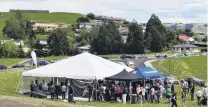  ??  ?? Busy auction . . . More than 100 people attend an auction at the Heathfield subdivisio­n in Mosgiel at the weekend.