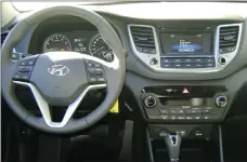  ??  ?? The Tucson tester has a heated steering wheel with audio controls and a large touchscree­n.