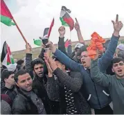  ?? [AP PHOTO] ?? Palestinia­ns chant slogans as they attend a demonstrat­ion Friday near the Gaza Strip border with Israel, in eastern Gaza City.