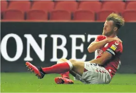  ?? Picture: Dan Mullan/Getty: ?? Bristol City skipper Tomas Kalas grimaces after injuring his shoulder against Northampto­n last night