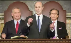  ?? ASSOCIATED PRESS PHOTO ?? Gov. TomWolf gives his 2016-17state budget address to the legislatur­e in Harrisburg on Tuesday. Behind him are House Speaker Mike Turzai, R-Allegheny County, left, and Lt. Gov. Mike Stack.