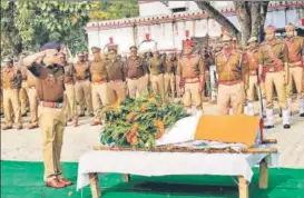  ?? PTI ?? Police officials pay tribute to inspector Subodh Kumar Singh in Etah on Tuesday. &gt;&gt; P12